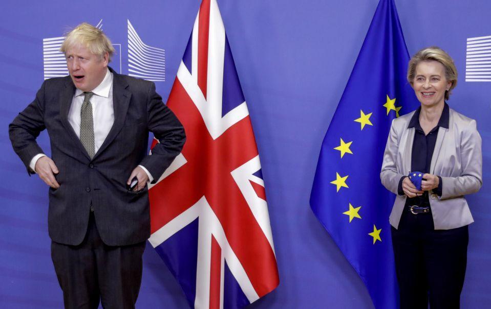 European Commission President Ursula von der Leyen, right, welcomes British Prime Minister Boris Johnson prior to a meeting at EU headquarters in Brussels, Wednesday, Dec. 9, 2020. Leaders of Britain and the EU meet Wednesday for a dinner that could pave the way to a post-Brexit trade deal, or tip the two sides toward a chaotic economic rupture at the end of the month. (Olivier Hoslet, Pool via AP)