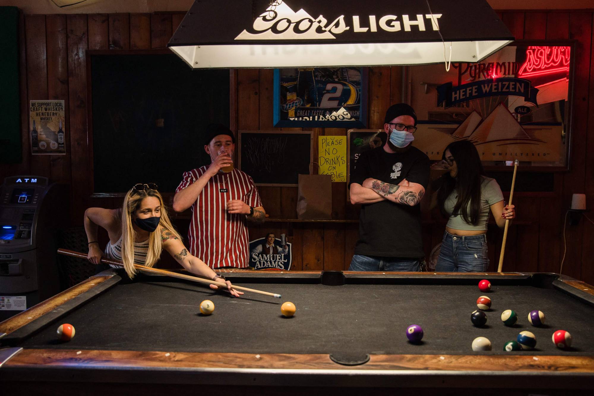 People play pool at a bar in San Diego, California, on Feb. 13. | AFP-JIJI